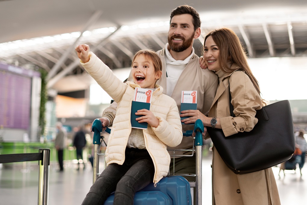 Family at airport with luggage